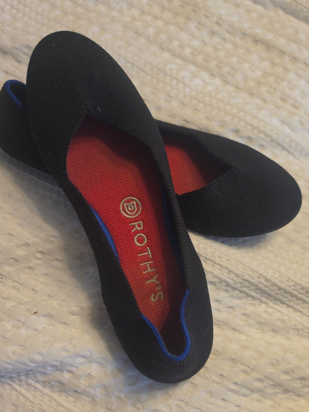 Rothy's Black Ballet Flat with Red Insole and Blue Trim